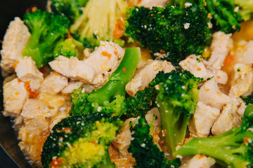 Broccoli cabbage with white meat. In the pan. A dish of chicken and vegetables.