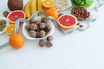 Colorful set of diet products, fruit and nuts closeup with copy space