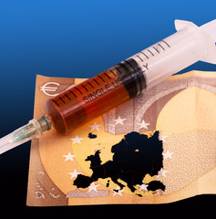 The syringe with against Coronavirus vaccine and a fifty-euro banknote on which Europe is marked....