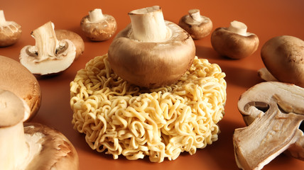 Asian instant noodles and mushrooms, traditional oriental food ramen and vegetables. fast food. The concept of vegetarianism. pasta, for the preparation of which it is enough to pour boiling water.