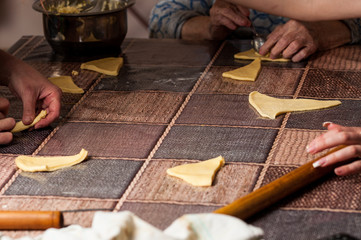 Women making dought.Dought for pizza and bread.Food