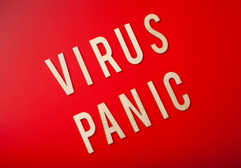 virus panic word text wooden letter on red background coronavirus covid-19