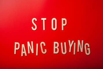 stop panic buying word text wooden letter on red background coronavirus covid-19