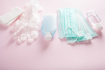 Obraz na płótnie Canvas protective medical mask, sanitizer gel and gloves. protective measures against virus, bacteria