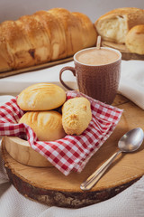 Baked breads on wooden table background.