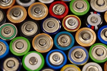 Many multicolored used batteries