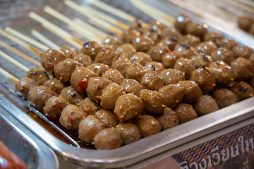 thailand street food grilled meatball on the grill