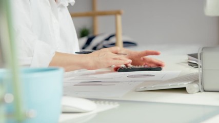 Young female accountant or millennial freelancer analyse her financial situation in terms of current events. Impact of covid on household finances and loan payments. Serious financial problems