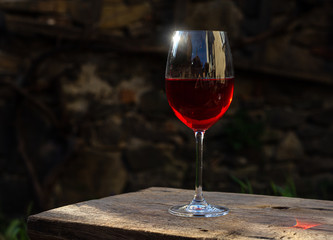 Glass of red wine in the sun