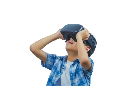 Boy wearing virtual reality glasses in modern interior design studio and trying to touch something appear in VR with exciting. Isolate background concept.Have clipping path.