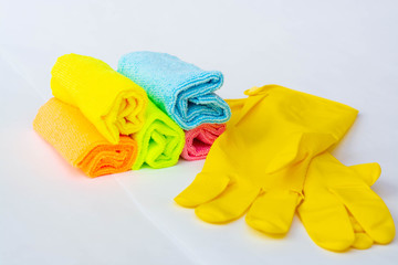 Bottles with detergent and cleaning supplies on white background