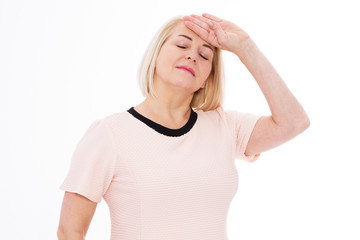 Covid 14 coronavirus simptome : Middle age woman head pain migraine, A middle-aged woman stands and touches her head with her hand - she has a temperature or head ache, health care concept