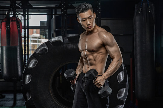 Asian man exercising in the gym, fitness, health, body good.