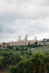 Fototapeta na wymiar Stormy weather over high towers of San Gimignano, Tuscany, Italy