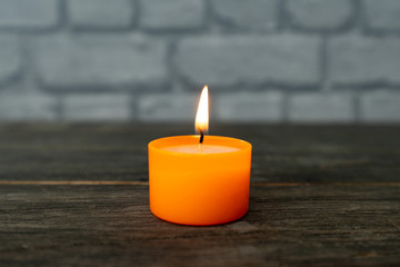 Obraz na płótnie Canvas colorful burning tea light candle