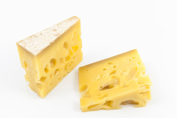 Gruyere cheese on top of a white background.