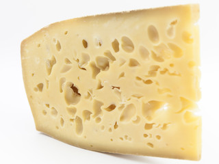 Gruyere cheese on top of a white background.