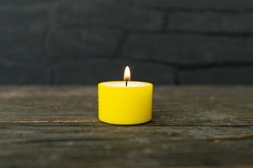 colorful burning tea light candle