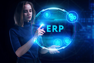 Business, Technology, Internet and network concept. Young businessman working on a virtual screen of the future and sees the inscription: ERP