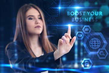 Business, Technology, Internet and network concept. Young businessman working on a virtual screen of the future and sees the inscription: Boost your business