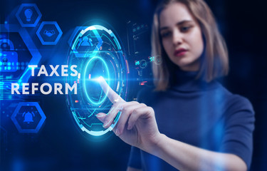 Business, Technology, Internet and network concept. Young businessman working on a virtual screen of the future and sees the inscription: taxes reform