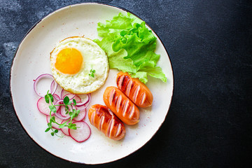 healthy breakfast, fried eggs sausages and vegetables Menu concept. food background. top view copy space for text keto or paleo diets