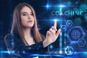 Business, Technology, Internet and network concept. Young businessman working on a virtual screen of the future and sees the inscription: Coaching