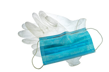 Disposable clear plastic gloves and facemask / face mask to prevent spreading germs during COVID-19 / coronavirus / corona virus pandemic