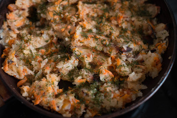 Potatoes are fried with greens