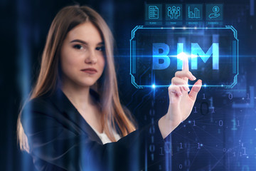 Business, Technology, Internet and network concept. Young businessman working on a virtual screen of the future and sees the inscription: BIM