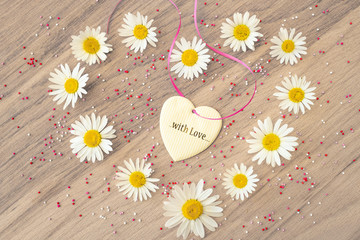 Obraz premium chamomile heart and the message with love