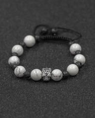 Round stone bracelets on a black background. Natural stone jewelry bracelets. bracelet made of stones.