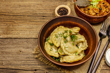 Dumplings stuffed stewed cabbage and sour cream. Traditional Ukrainian dish varenyky