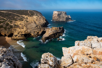 Cliff at Cabo de Sao Vincente. Solo Backpacker Trekking on the Rota Vicentina and Fishermen's Trail in Algarve, Portugal. Walking between  ocean, nature and beach.