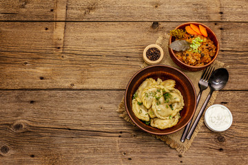 Dumplings stuffed stewed cabbage and sour cream. Traditional Ukrainian dish varenyky