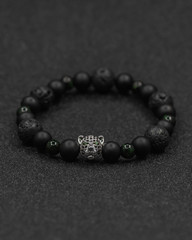 Round stone bracelets on a black background. Natural stone jewelry bracelets. bracelet made of stones.