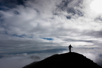 silhouette of a man on a mountain top