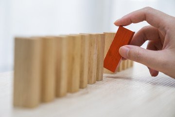 Domino,Wooden block,Business risk, strategy and planning concept idea.