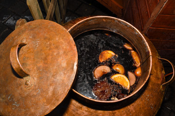 Mulled wine in large pot for sale during Christmas market