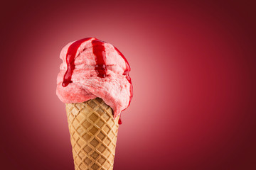 Strawberry ice cream cone on purple background