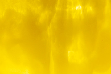 Abstract yellow background with flares and shadows