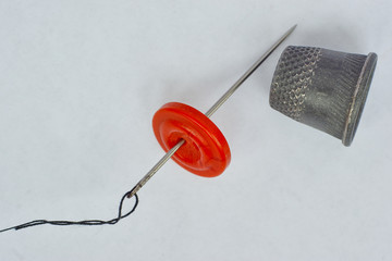 Button and needle