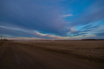 Fototapeta na wymiar colorful clouds over field