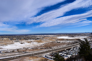 Snow covered road and highway with cloudy sky from Dinosaur Ridge, Colorado, USA