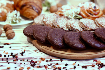Scene with an assortment of pastries, original Nuremberg gingerbread cookies, rolls, croissants...