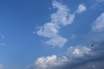 Sunny blue sky, Nature white clouds, and beautiful colors on the horizon.