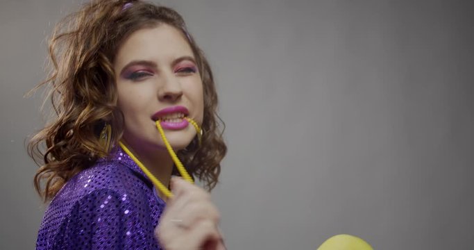 Pretty fashion model from the 80s is posing in the studio, 4k
