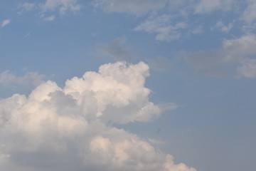 Sunny blue sky, Nature white clouds, and beautiful colors on the horizon.