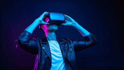 Handsome young man using a virtual reality headset