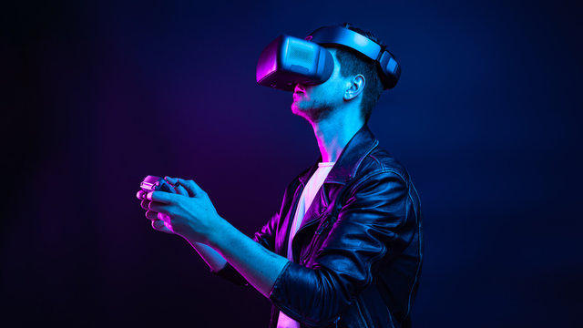 Handsome young man using a virtual reality headset